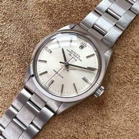 rolex air kng 5500 with suit